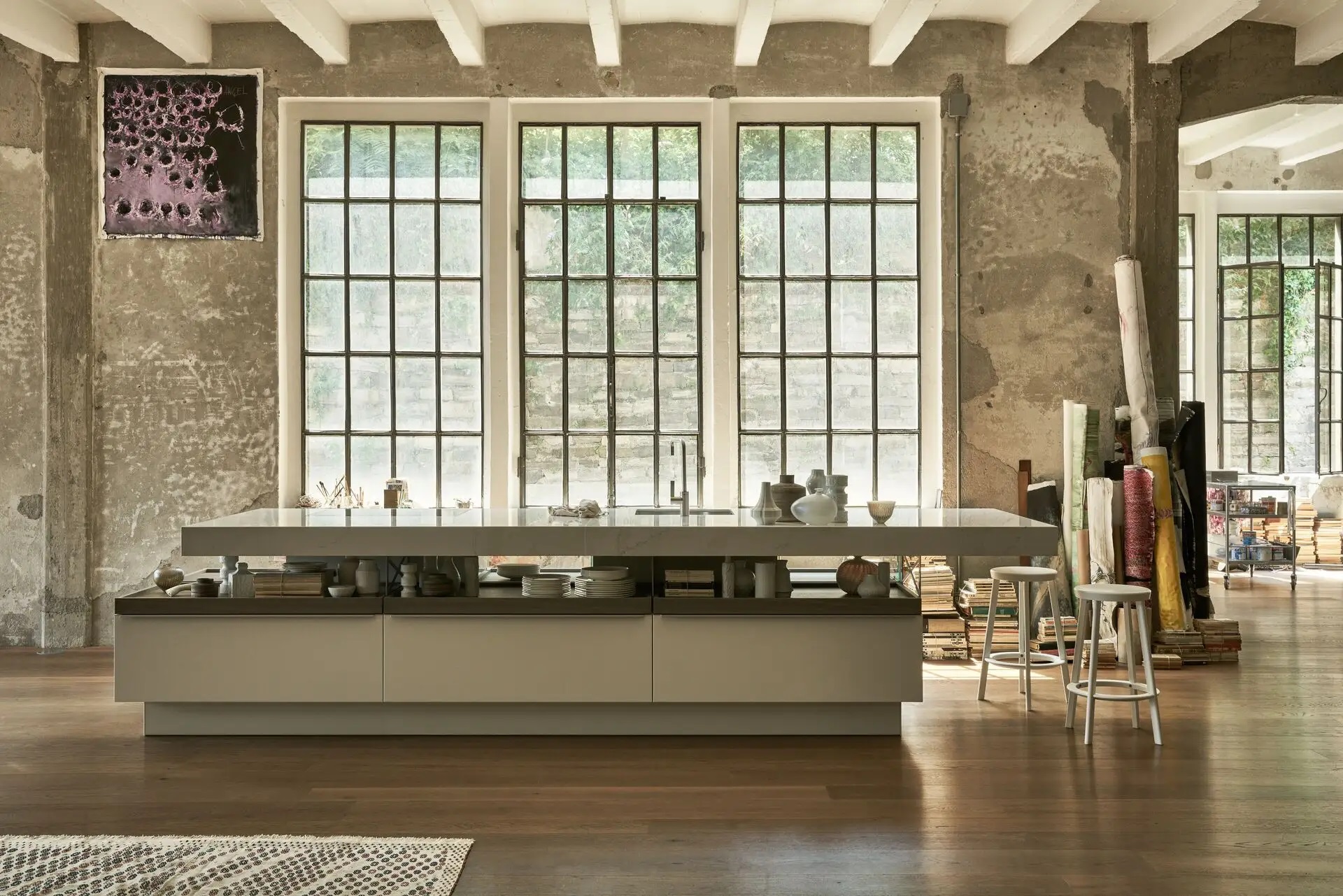 Poggenpohl kitchen interior with warm light and dark cabinetry